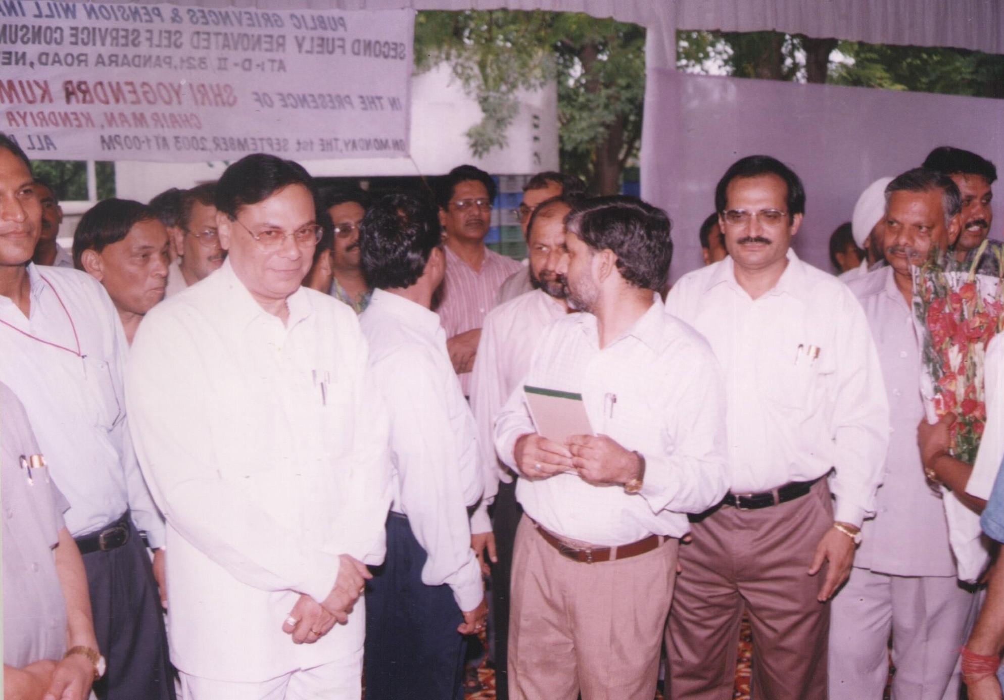 Photograph of former chairman with various dignatories